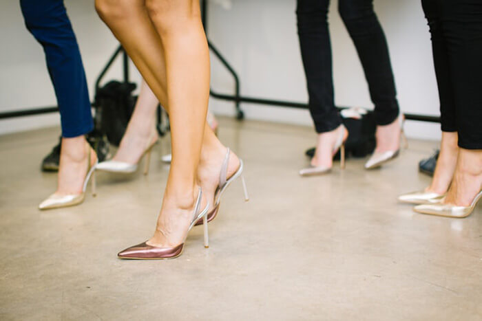 why do women wear high heels