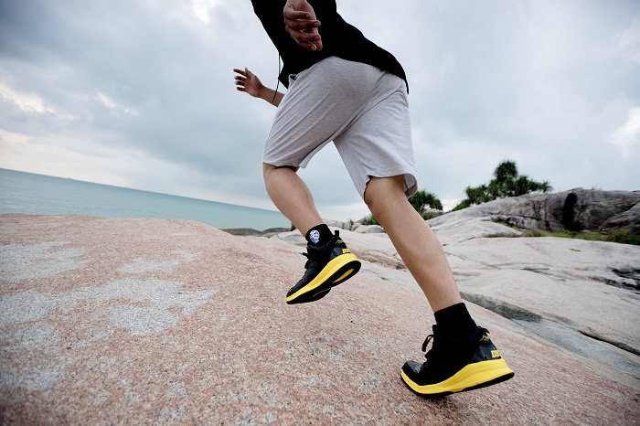 black and yellow running shoes